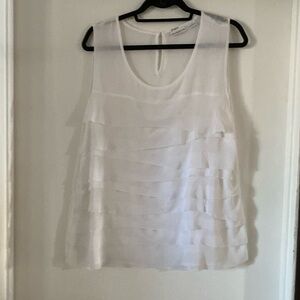 White sleeveless top.